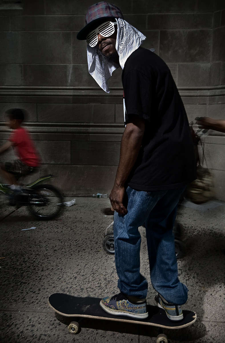 Skateboarder at the National Puerto Rican Day Parade, photographed between Fifth Avenue and Madison Avenue on the Upper Eastside, NYC.