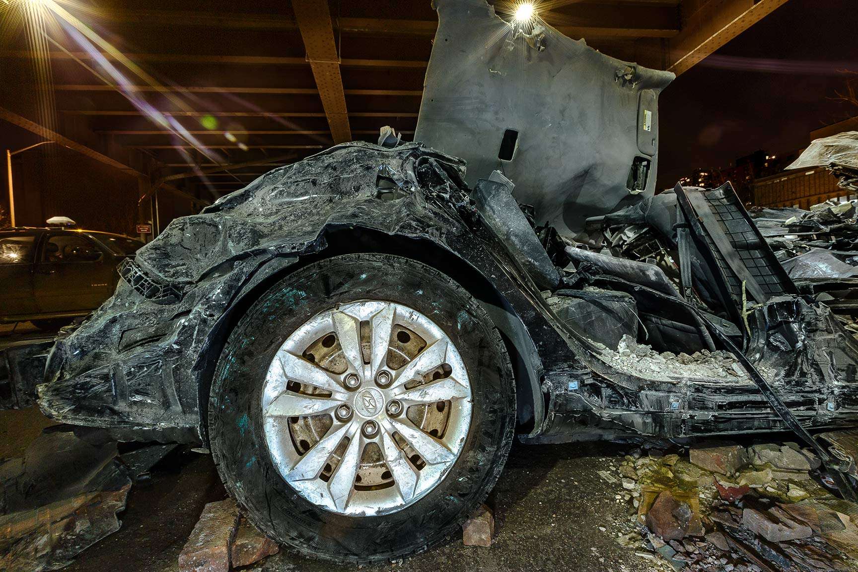 Concrete Landscapes a personal series re-examining what is meant by Landscape Photography.. the intersection of nature and man in an urban environment.  Car damaged from a building explosion in Harlem, NYC. : Concrete Landscapes : New York City portrait photographer