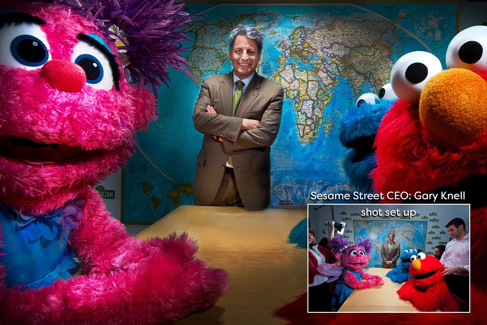 Gary Nell CEO of Sesame Street photographed with characters from the children's television for an article on their worldwide marketing. : Portraits-Keywording : New York City based photographer and video specializing in portrait corporate portraits, video, editorial stories for on location and architectural photography
