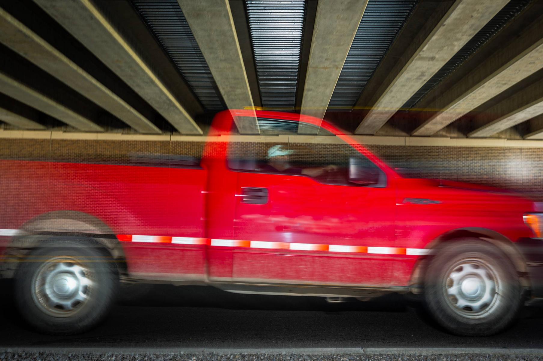 Big Beaver- Michigan:  Michigan is all about cars. I was walking around and noticed this location under an overpass where car after car keep coming.  I found the ceiling to be a wonderful backdrop to photograph all the motion.  : On The Road : New York City portrait photographer