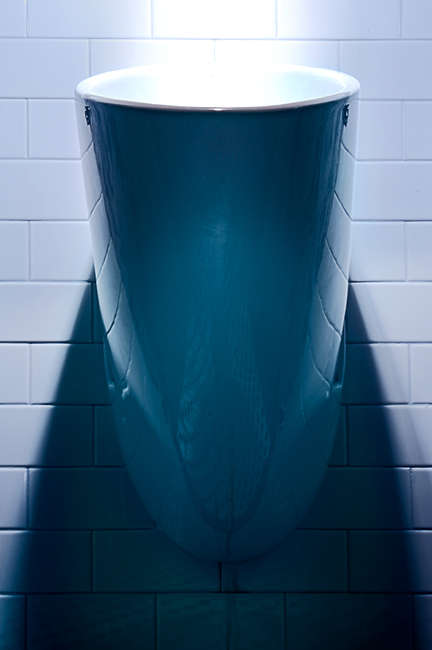 Waterless toilet in the mens room at the Proximity Hotel, Greensboro, North Carolina saving thousands of gallons of water each year and reducing water bills - state of the art GREEN hotel one of the first LEED certified in the USA saving 