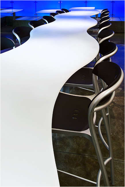 Whole Foods Market NYC resin table and colored resin wall in customer dining area