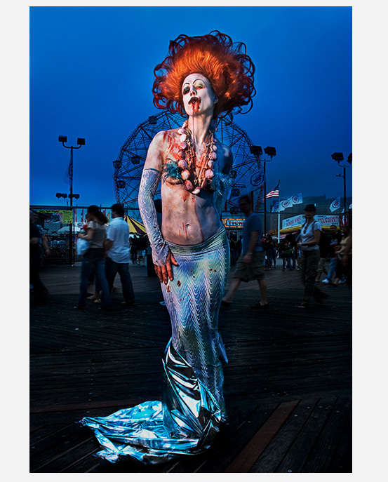 Mermaid Parade Coney Island Brooklyn NY portrait photographed on broadwalk with Ferris wheel in background