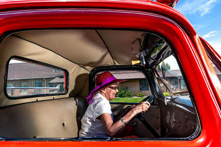 Mom test driving a 1933 Ford fire truck... very slowly. Winner First Place 2025 NCOA Photography Award. 